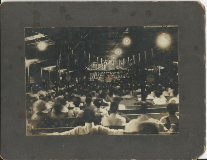 Interior shot of a Chautauqua being held in the Rich Hill Opera House.  Date unknown. 