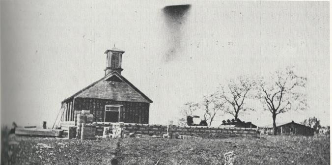 The old Crescent Hill Church with the foundation of the new church in the foreground.  Taken from the book: "Adrian: Our Home Town 1880-1980".